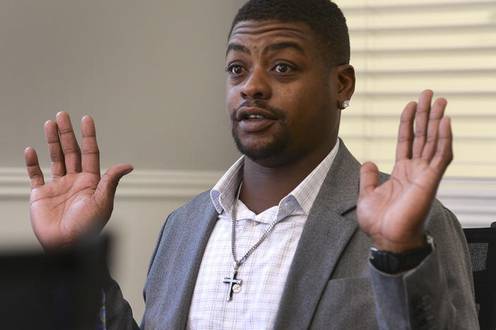 Jeffery Ryans, who sustained multiple dog bites, is shown here discussing his encounter with Salt Lake City police at his attorney's office in Salt Lake City.