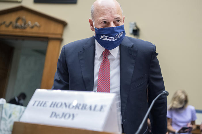 Postmaster General Louis DeJoy arrives to testify during a House Oversight and Reform Committee hearing in August.