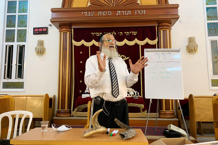 Rabbi Yehonatan Adouar teaches a shofar blowing course in Rambam Synagogue in Ramat Gan, Israel