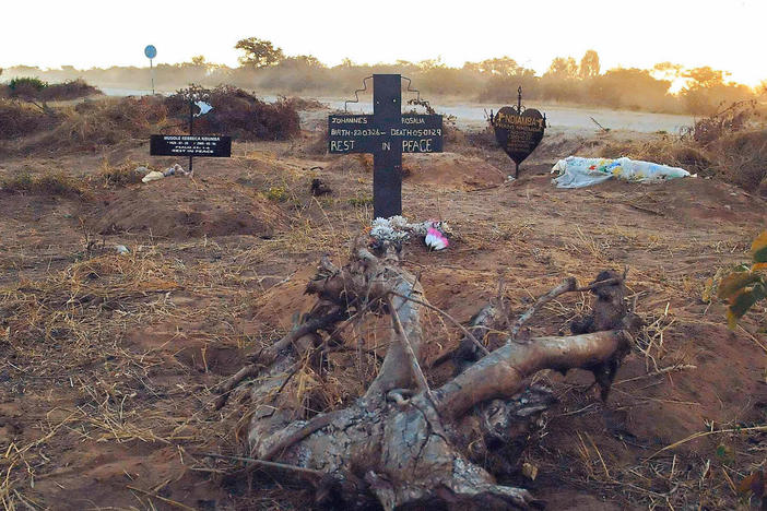 An illegal roadside graveyard in northeastern Namibia. People in the townships surrounding Rundu, a town on the border to Angola, are too poor to afford a funeral plot at the municipal graveyard — and resorted to burying their dead next to a dusty gravel road just outside of the town.