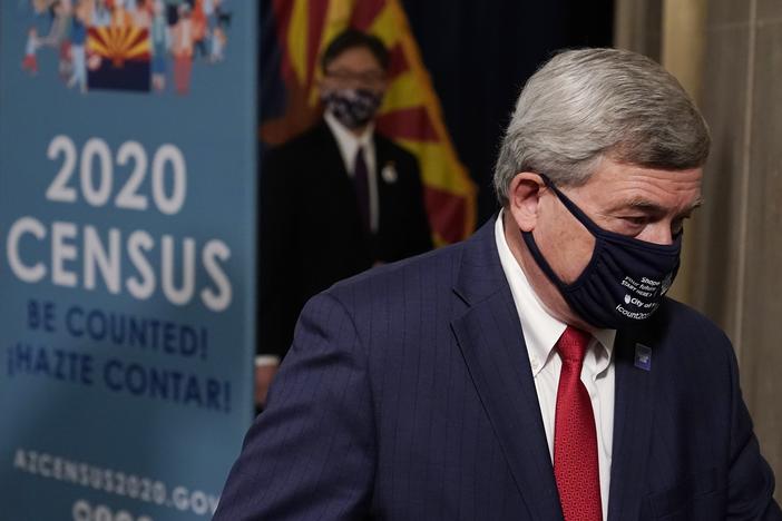 U.S. Census Director Steven Dillingham departs a Sept. 17 news conference in Phoenix. The Trump administration is facing two federal lawsuits over its last-minute decision to cut the 2020 census schedule short.