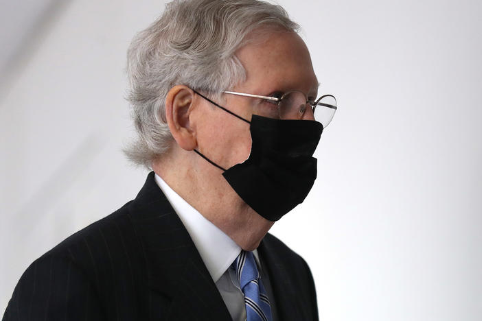 Senate Majority Leader Mitch McConnell arrives for a Republican Senate luncheon Wednesday on Capitol Hill.