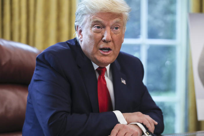 President Trump, pictured in the Oval Office on Thursday, maintains a lead over Democratic presidential nominee Joe Biden on the economy, but is behind on handling of the coronavirus pandemic in a new NPR/<em>PBS NewsHour/</em>Marist poll.