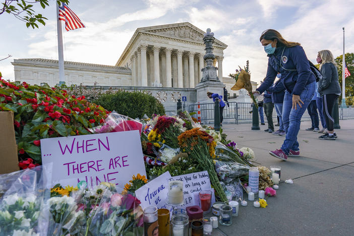 People gather at the Supreme Court on the morning after the death of Justice Ruth Bader Ginsburg.
