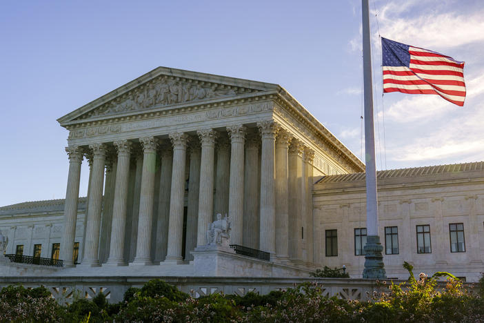 The flag flies at half-staff Saturday at the Supreme Court on the morning after the death of Justice Ruth Bader Ginsburg.
