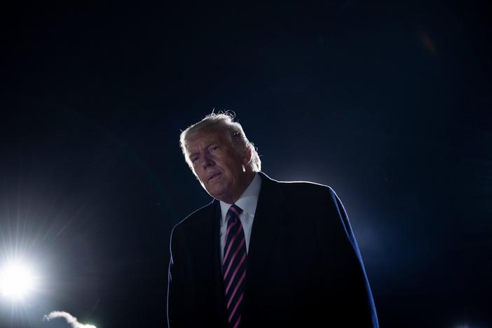 President Trump reacts to the news of the death of Supreme Court Justice Ruth Bader Ginsburg on Friday on the tarmac of Bemidji Regional Airport in Minnesota.