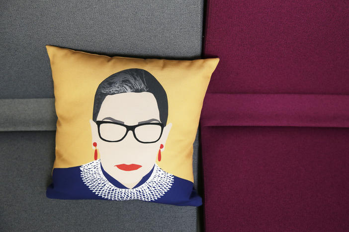 A pillow with Ruth Bader Ginsburg's likeness on it sits on a couch inside the office of ActBlue, a Democratic fundraising platform, in Somerville, Mass.