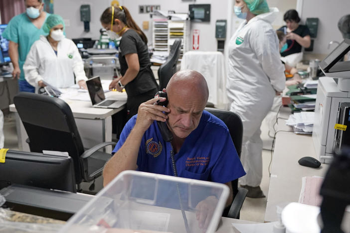 Dr. Joseph Varon notifies the family of a patient who died inside the coronavirus unit at Houston's United Memorial Medical Center on July 6. Varon tells NPR he's "living on adrenaline."