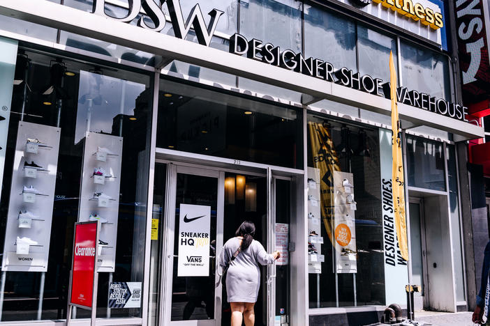 A shopper enters a DSW store in New York City. DSW is partnering with Hy-Vee, a Midwest supermarket chain, to offer shoes in grocery stores.