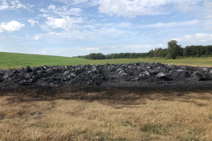 Vandals struck Terry Fuller's farm a few days ago, burning 367 bales of hay. Fuller is trying to limit use of a herbicide called dicamba, which has pitted farmers against each other.