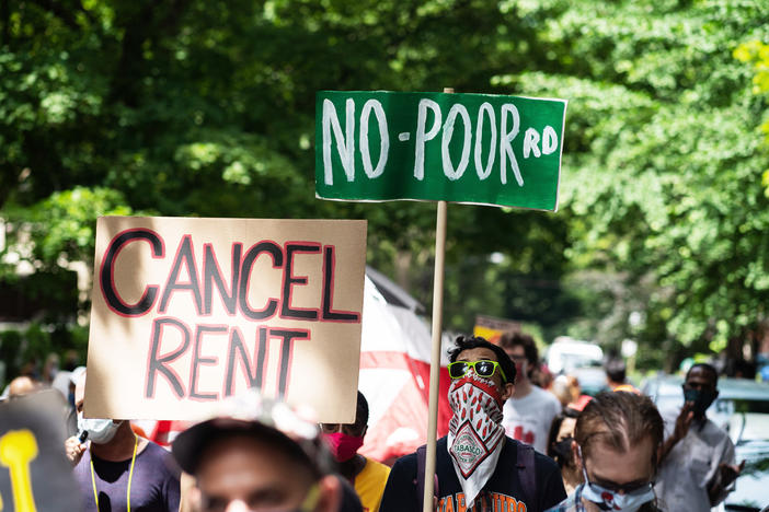 Demonstrators march in Chicago's Old Town neighborhood in June to demand a lifting of the Illinois rent control ban and a cancellation of rent and mortgage payments. The pandemic's financial pressures are causing many Americans to struggle with rent payments.