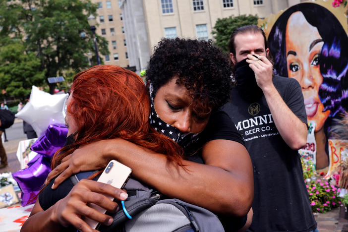 People react after a decision in the criminal case against police officers involved in the death of Breonna Taylor, who was shot dead by police in her apartment, in Louisville.