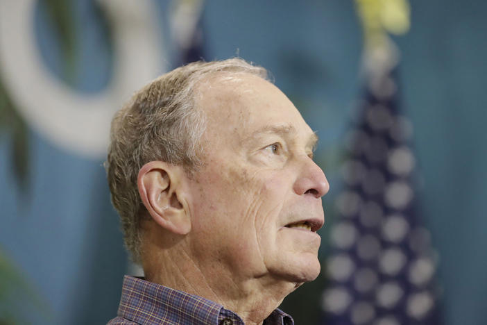Mike Bloomberg, then a Democratic presidential candidate, speaks at a news conference in March in Miami's Little Havana neighborhood. Bloomberg has helped raise money to pay off felons' fines so they can vote in Florida.