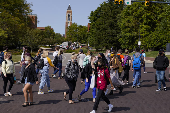 As students return to college campuses, the surrounding communities are seeing an increase in coronavirus infections.