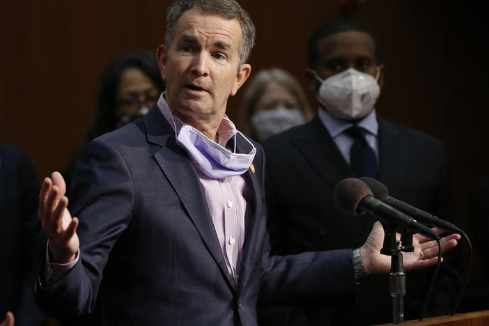 Virginia Gov. Ralph Northam, shown here at a news conference in June, has tested positive for the coronavirus.