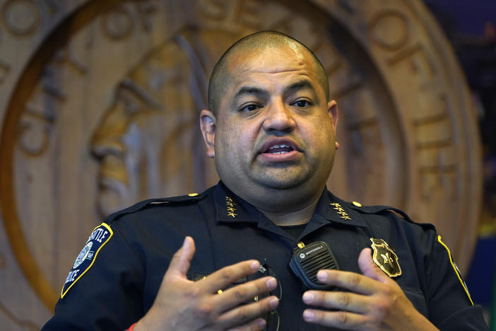 Interim Seattle Police Chief Adrian Diaz addresses a news conference about changes being made at the department, earlier this month. The SPD announced Thursday that an officer seen on video rolling his bicycle over a downed protester was suspended pending an investigation.