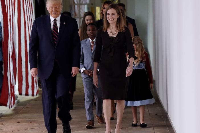 President Trump and Judge Amy Coney Barrett walk to the Rose Garden of the White House on Saturday.