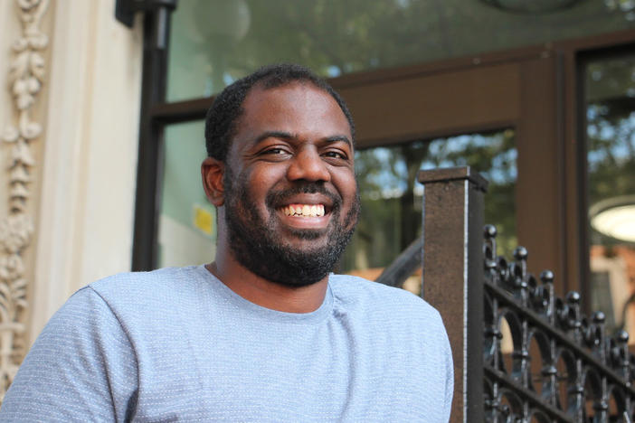 Donnel Baird stands in front of a building where his company, BlocPower, has installed energy-saving heating and solar panels. "Solar panels aren't just for rich people, or for White people. They're for everybody," Baird says.