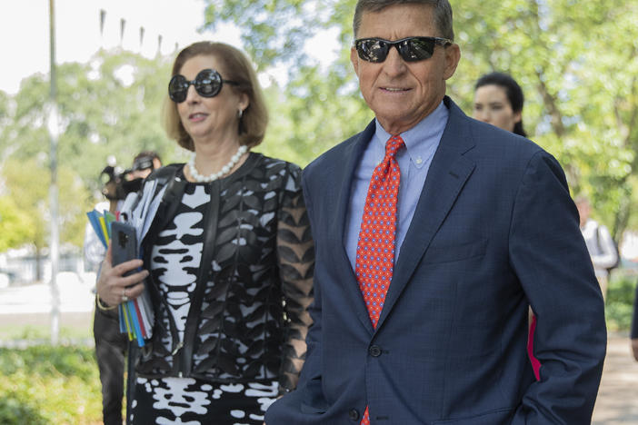 Michael Flynn, President Trump's former national security adviser, leaves federal court with lawyer Sidney Powell in September 2019.