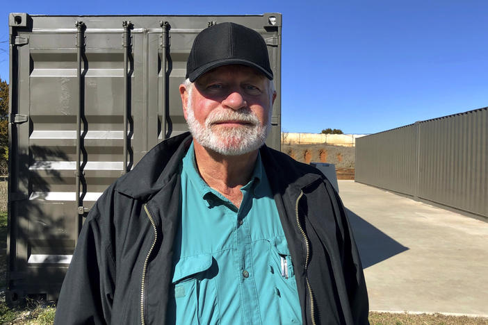Jack Wilson poses for a photo at a firing range outside his home in Granbury, Texas. Wilson, who trains the volunteer security team of the West Freeway Church of Christ, killed a man who fatally shot two people there on Dec. 29.