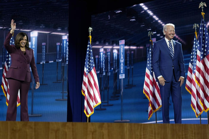 Sen. Kamala Harris stands with former Vice President Joe Biden after speaking last month during the Democratic National Convention.