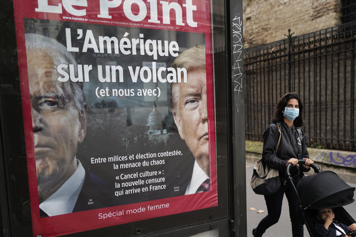 The French weekly <em>Le Point</em> displays a photo of President Trump and Democratic presidential candidate Joe Biden under a headline reading "America on a volcano (and us too)" in Paris, on Wednesday.