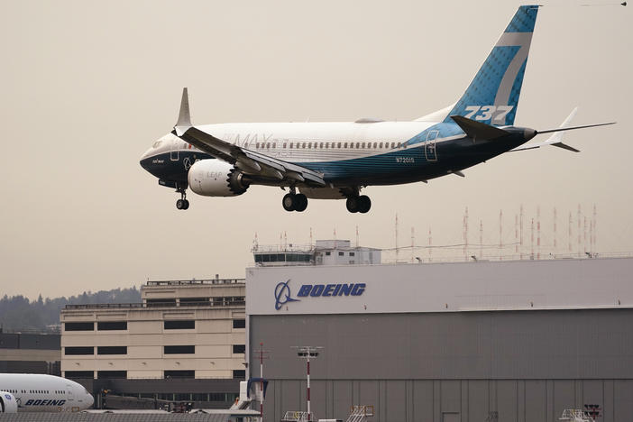 A Boeing 737 MAX jet, piloted by Federal Aviation Administration (FAA) chief Steve Dickson, prepares to land at Boeing Field following a test flight on Wednesday.