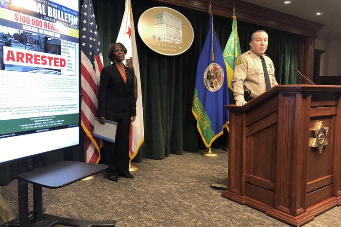 Los Angeles County Sheriff Alex Villanueva, right, and District Attorney Jackie Lacey, at a news conference on Wednesday announce the arrest of a man in connection with the shooting of two Los Angeles County sheriff's deputies.