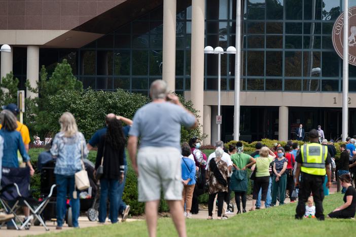 Voters wait in line to cast their ballot at an early voting location in Fairfax, Va., on Sept. 18. Growing tensions in the country have some election officials worried about potential violence at polling places.