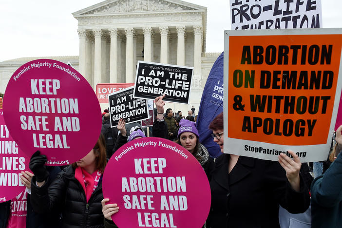 Activists on opposite sides of the abortion debate demonstrate in front of the Supreme Court during the annual anti-abortion-rights event known as the March for Life, on Jan. 24 in Washington, D.C.
