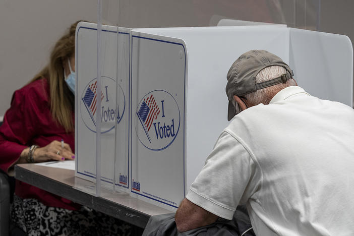 Voters cast ballots during early voting last month in Fairfax, Va. During the first presidential debate, President Trump would not commit to refraining from declaring victory until the election has been independently certified.
