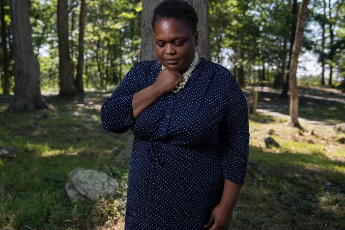 Thomas poses for a portrait at the African American Burial Ground for the Enslaved at Belmont. Thomas restored the graveyard and then used it to bury her teenage son when he drowned in June.