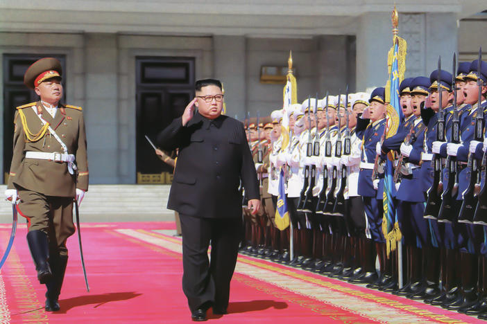 Kim Jong Un inspects troops ahead of North Korea's 70th anniversary parade in Pyongyang in 2018. At least one foreign policy expert warns that U.S. adversaries could take advantage of the uncertainty stemming from President Trump's positive coronavirus test.