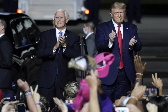 President Trump and Vice President Pence arrive for a campaign rally in Newport News, Va., on Sept. 25 — several days before Trump tested positive for the coronavirus.