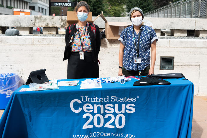 U.S. Census Bureau workers stand outside Lincoln Center in New York City in September. A federal judge has ordered the bureau to keep counting for the 2020 census through Oct. 31 for now.