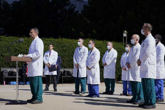 Dr. Sean Dooley briefs reporters at Walter Reed National Military Medical Center in Bethesda, Md. on Saturday. Trump was admitted to the hospital after contracting the coronavirus.
