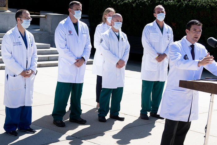 White House physician Dr. Sean Conley, with medical staff, gives an update on the condition of President Trump on Saturday at Walter Reed Medical Center in Bethesda, Md.
