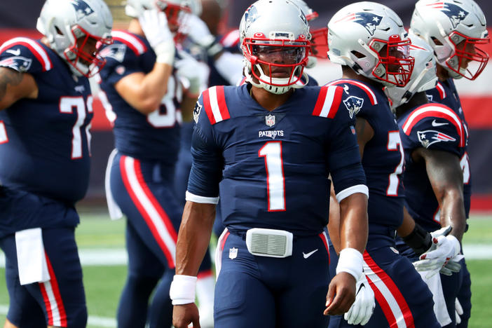 Cam Newton of the New England Patriots looks on before a game against the Las Vegas Raiders at Gillette Stadium last Sunday. A game between the Patriots and Kansas City Chiefs was postponed after players from both teams tested positive for the coronavirus.
