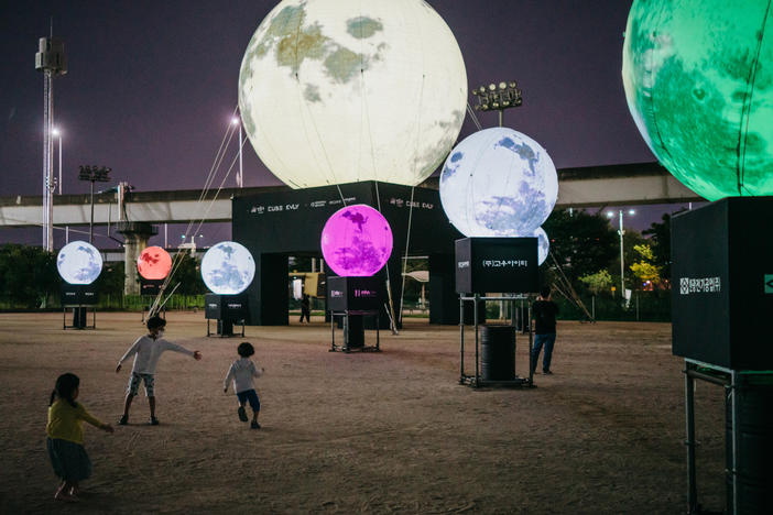 A day before the Chuseok holiday, children run around artificial full moons, part of an installation at a park in eastern Seoul. Koreans believe that wishes made to the full moon on Chuseok will come true. The Seongdong District Office teamed up with local businesses to install the moons as a way to convey hope in the time of COVID-19.