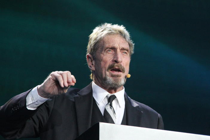 John McAfee gives a speech in August 2016 at a Beijing conference. McAfee has been arrested on tax evasion charges in Spain.
