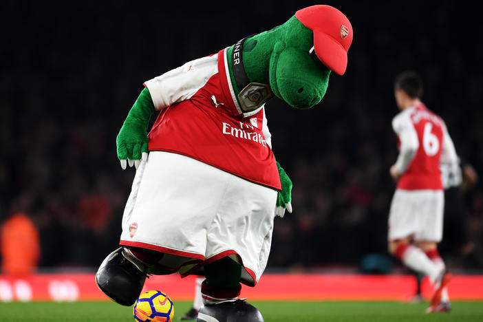 Gunnersaurus is seen warming up prior to a match at Emirates Stadium in 2017 in London. Jerry Quy, who played the team's mascot Gunnersaurus for 27 years, was recently told he would be let go.