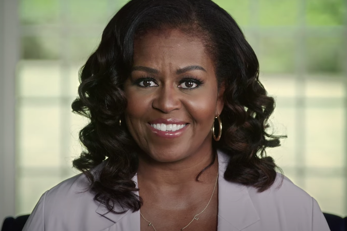 President Trump "continues to gaslight the American people by acting like this pandemic is not a real threat," Michelle Obama says in video remarks.