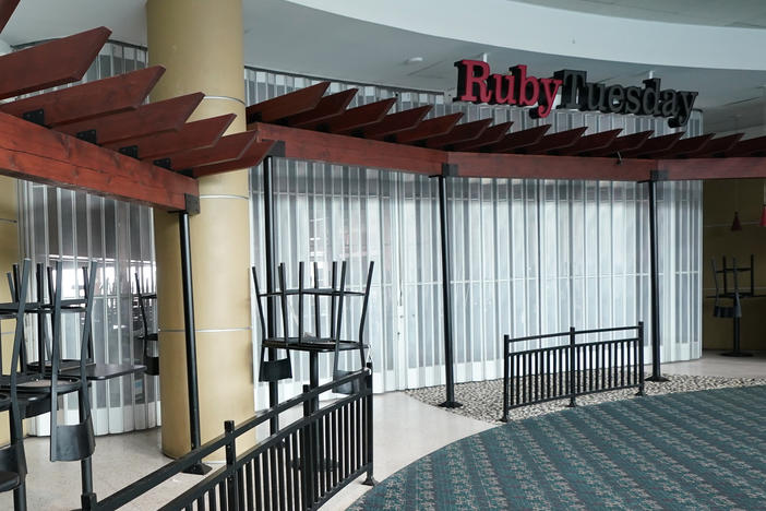 Chairs are stacked outside a closed Ruby Tuesday restaurant at Orlando Intercontinental Airport on May 24, 2020.