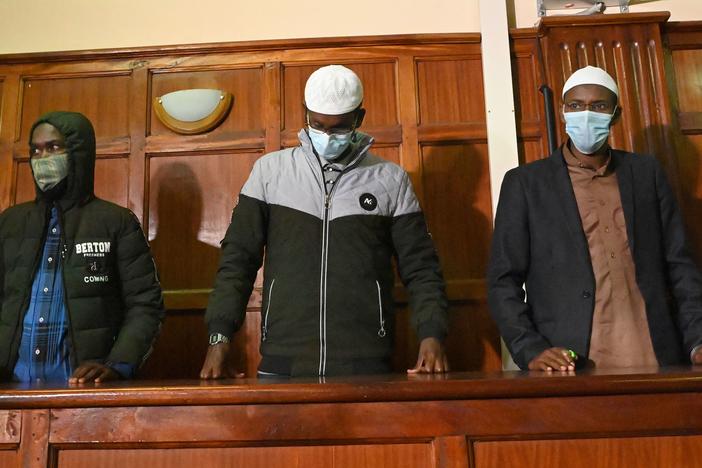 Suspects (left to right) Hassan Hussein Mustafa, Liban Abdullahi Omar, and Mohamed Ahmed Abdi standing in the dock during their appearance for their case at the Milimani court in Nairobi on Wednesday. Abdi and Mustafa were found guilty, while Omar was acquitted of charges.