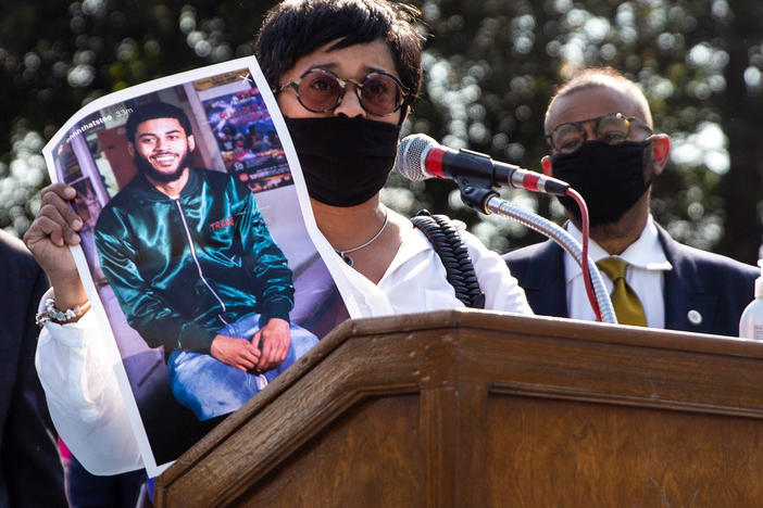 Tamika Morales holds a photo of her son, Ahmad, who was killed in South Philadelphia last July.