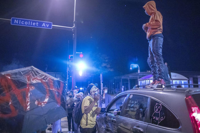 Protesters gather outside the Minneapolis Police Department's 5th Precinct on Wednesday following the release of former police Officer Derek Chauvin. He posted a $1 million bond.