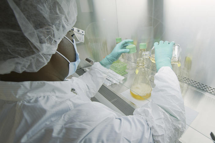 An Eli Lilly researcher tests possible COVID-19 antibodies in a company laboratory in Indianapolis.