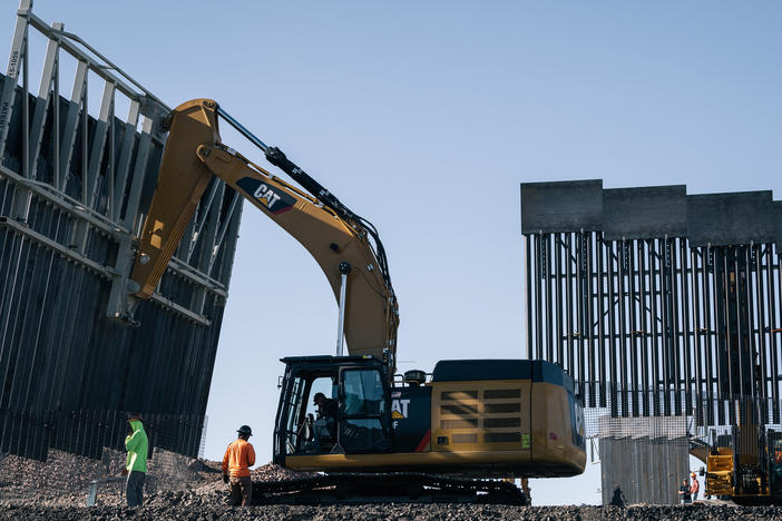 Fisher Industries workers move sections on May 24, 2019 in Sunland Park, N.M., near International Boundary Monument No. 1 where New Mexico, Texas and Mexico come together.