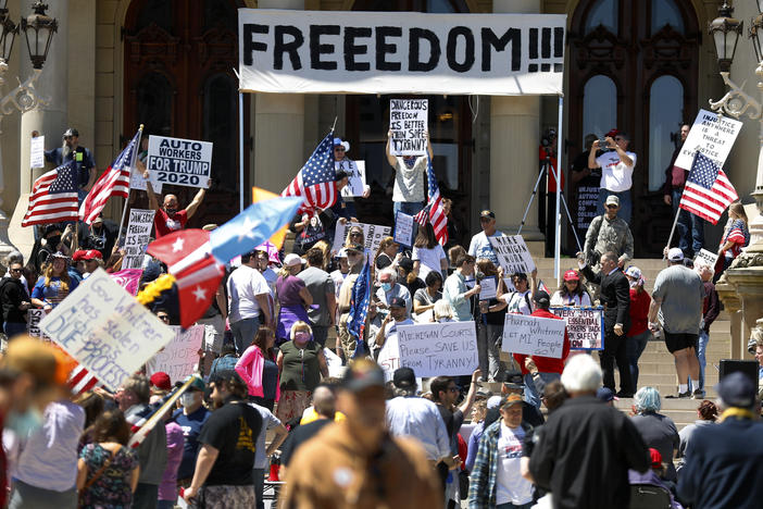 People protest at the state Capitol during a rally in Lansing, Mich., in May against Gov. Gretchen Whitmer's stay-at-home order.