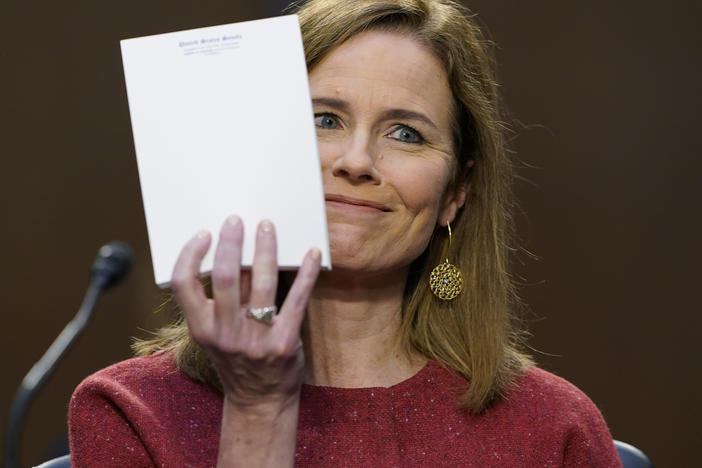 Supreme Court nominee Amy Coney Barrett responds to a question from Sen. John Cornyn, R-Texas, about the materials she used at her hearing on Tuesday: none. She displayed an unused Senate notepad.